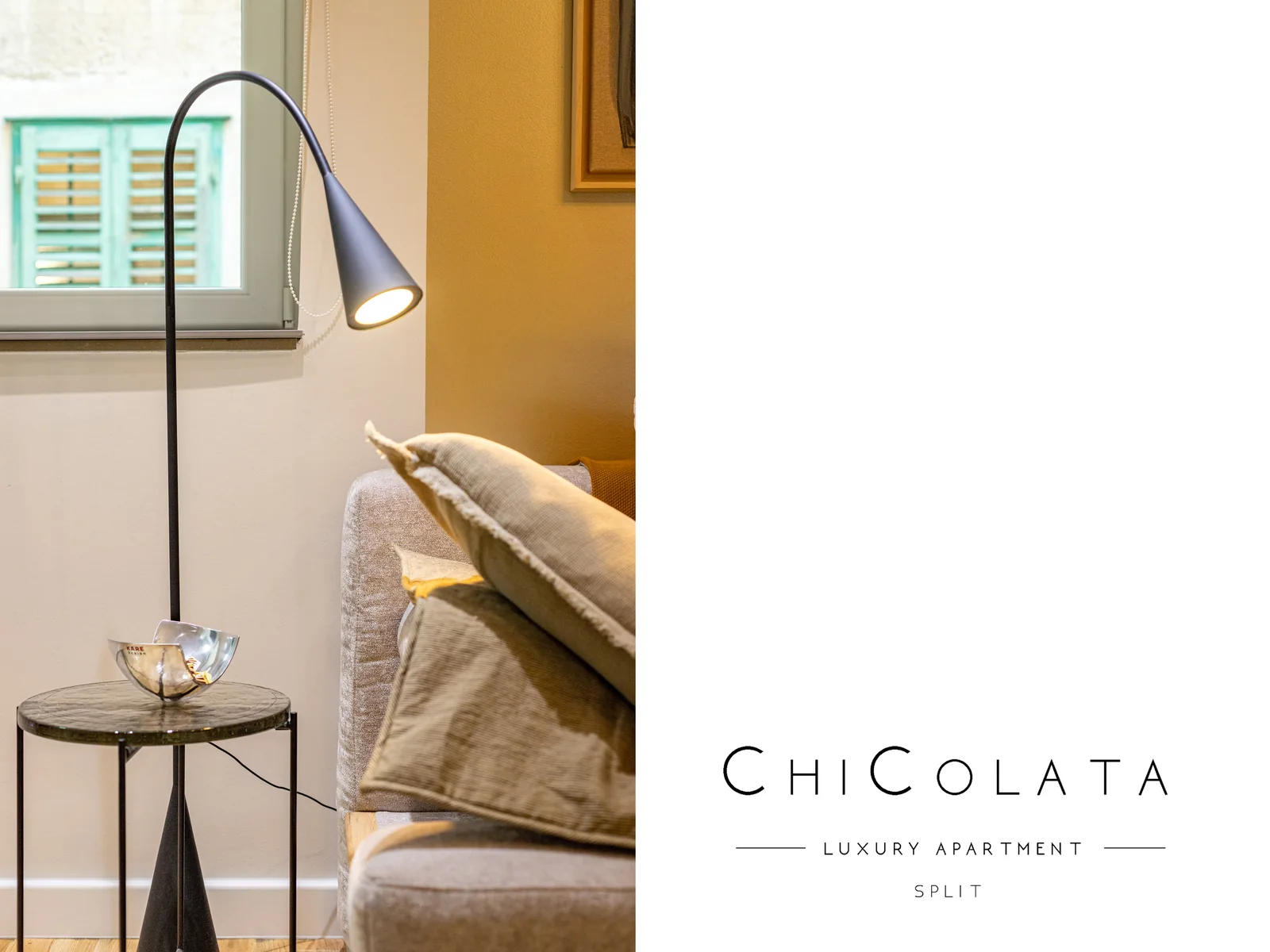 Living-room detail with warm lamplight and brass tables